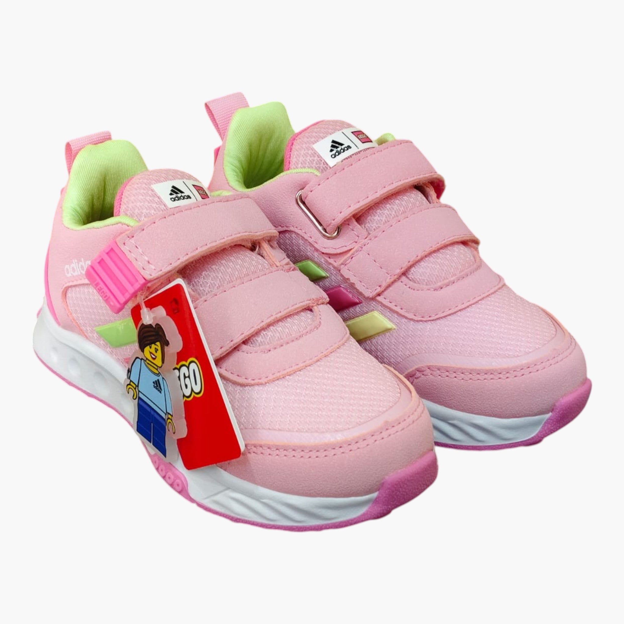 Tenis rosas de velcro para niña de Planet Shoes Sneakers, con detalles de Lego y Adidas, ideales para el juego.